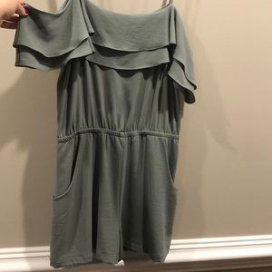 An army green size L romper from south moon under
